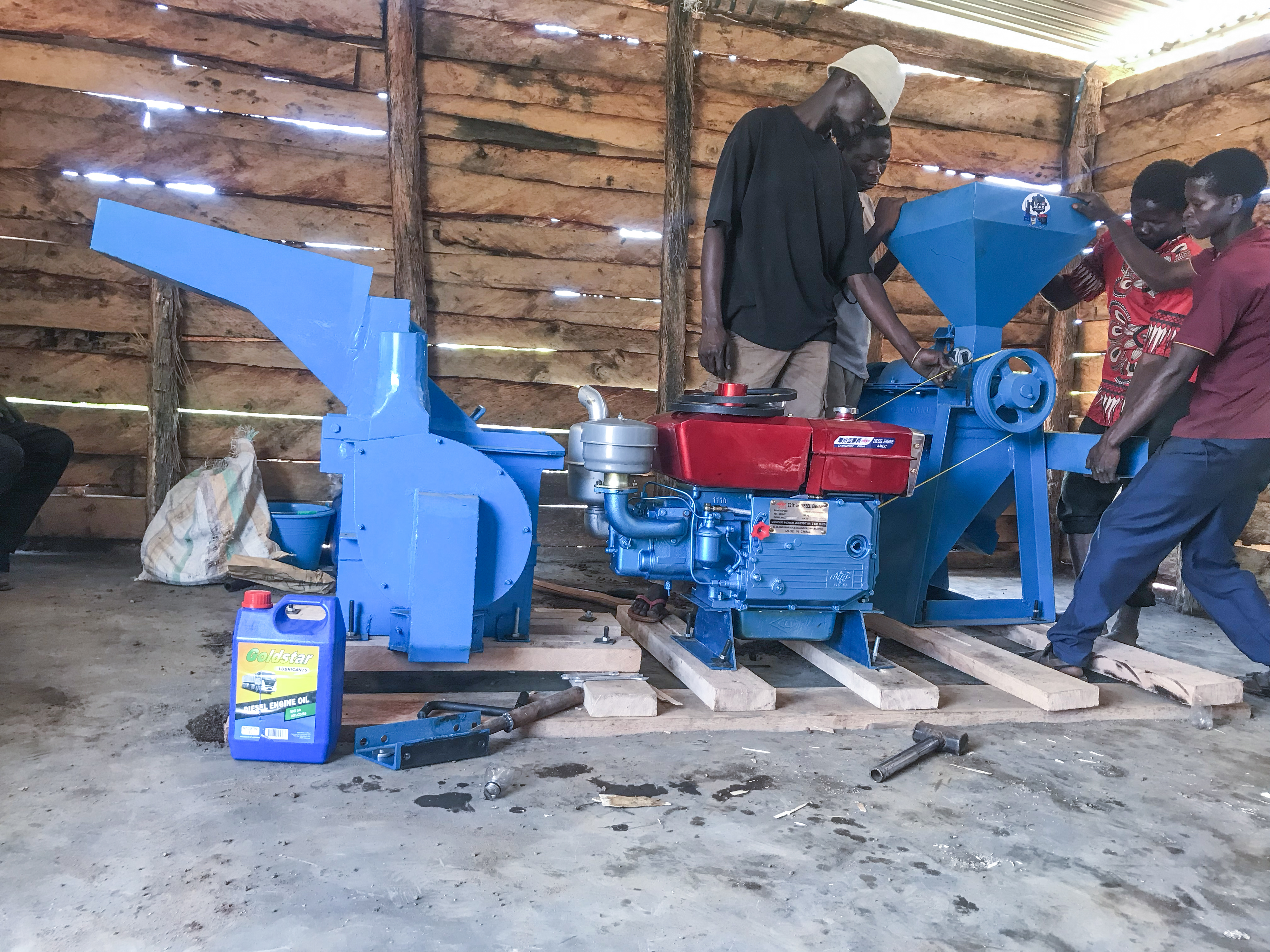 Community members installing mill